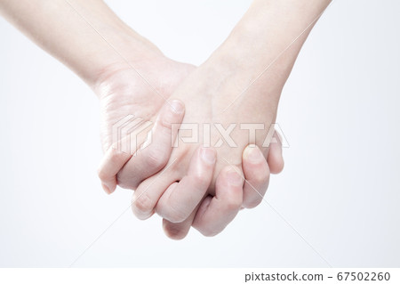 Male and female joining hands 67502260