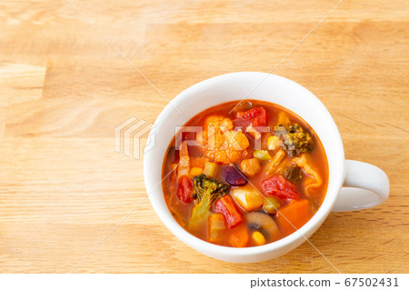 Minestrone soup table 67502431