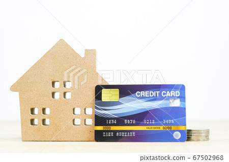 House model and credit card on table House model and credit card on table 67502968