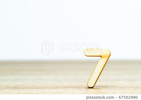 Wooden numeric on table ,number seven 67502990