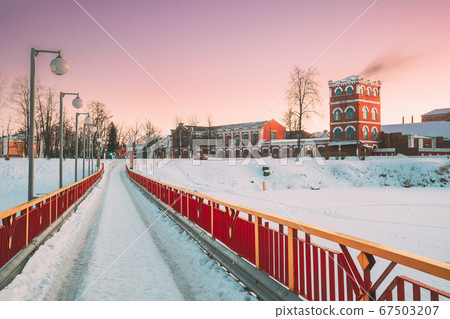 Dobrush, Gomel Region, Belarus. Old Paper Factory Tower In Winter Evening. Historical Heritage 67503207