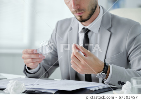 Taking pill at workplace Taking pill at workplace 67503457
