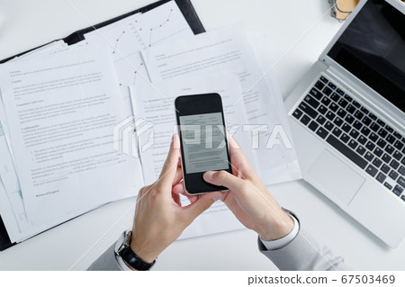 Photographing contract papers Photographing contract papers 67503469