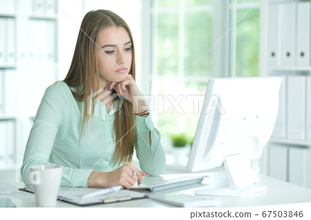 Portrait of a businesswoman working in office Portrait of a businesswoman working in office 67503846