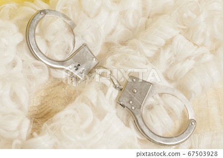 judge wig with handcuffs.judicial concept. judge wig with handcuffs.judicial concept. 67503928