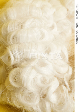 Judge wig on a yellow background. Judge wig on a yellow background. 67503950