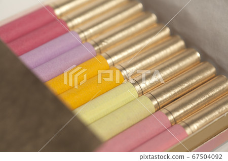 Box of colorful cigarettes close up . 67504092