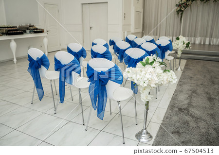 Bright room for weddings. Rows of guest chairs 67504513