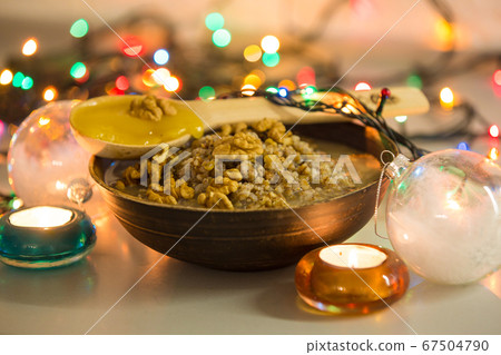 Christmas kutia from wheat, raisins and nuts, selective focus Christmas kutia from wheat, raisins and nuts, selective focus 67504790