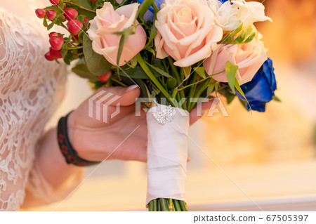 Decorative bouquet of fresh flowers for the bride 67505397