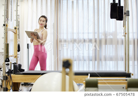 Young woman,exercise,pilates,sport Young woman,exercise,pilates,sport 67505478