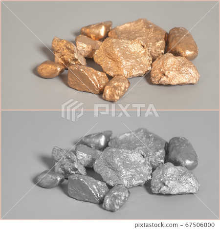 Silver end golden nuggets on gray background 67506000