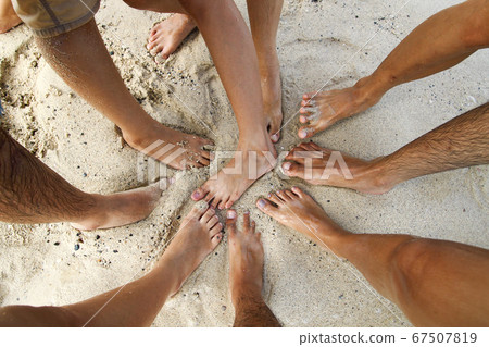 Gruop legs asia people on sand beach in thailand Gruop legs asia people on sand beach in thailand 67507819