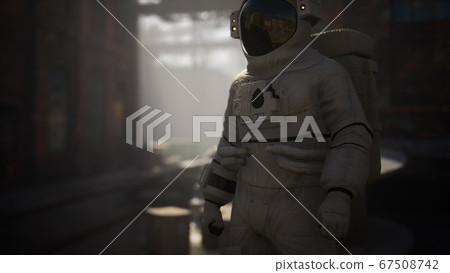 Lost Astronaut near Abandoned Industrial Buildings Lost Astronaut near Abandoned Industrial Buildings 67508742