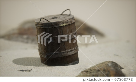 old wooden basket on the sand at the beach 67508778
