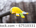 Lost children's multi-colored wool glove awaits the owner 67510331