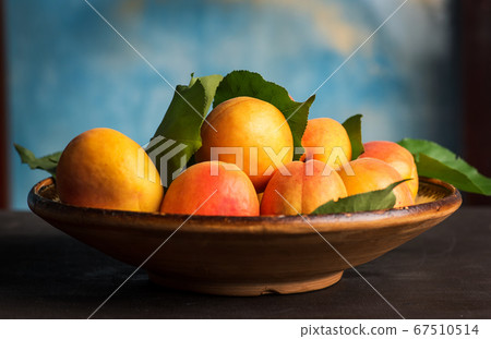 Ripe Apricot fruit isolated on a wooden table in a Ripe Apricot fruit isolated on a wooden table in a 67510514
