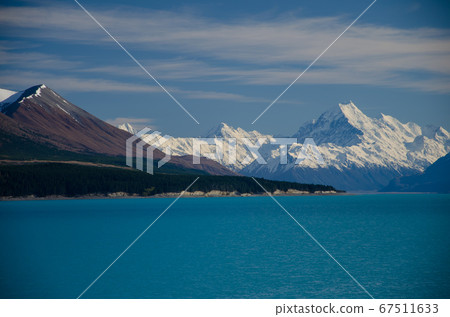 Distant view of Mount Cook across Lake Pukaki, South Island, New Zealand Distant view of Mount Cook across Lake Pukaki, South Island, New Zealand 67511633