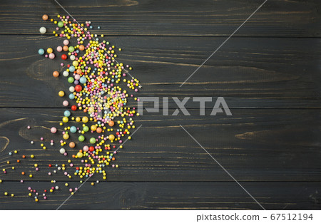 Colorful polystyrene foam on a black wooden Colorful polystyrene foam on a black wooden 67512194