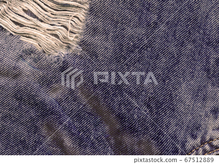 Blue denim jean texture background. Jeans torn Blue denim jean texture background. Jeans torn 67512889