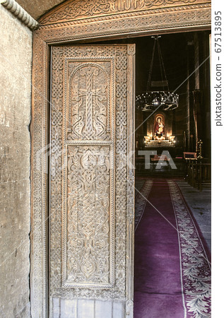 Entrance wooden door with cross in the Church of the Martyr St. Hripsime in Echmiadzin 67513895