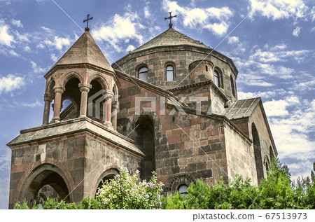 Umbrella-shaped roof with a cross and rotunda with columns on the church great martyr St. Hripsime 67513973