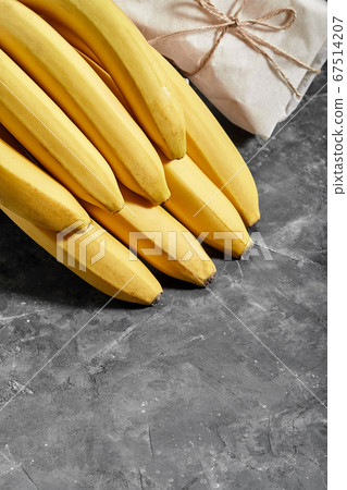 Bananas isolated on gray cement background Clipping Path 67514207