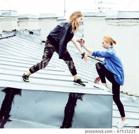 two cool blond real girls friends making selfie on roof top, lifestyle people concept, modern teens two cool blond real girls friends making selfie on roof top, lifestyle people concept, modern teens 67515225