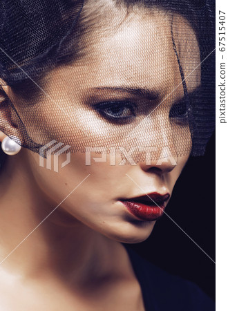 beauty brunette woman under black veil with red manicure close up 67515407