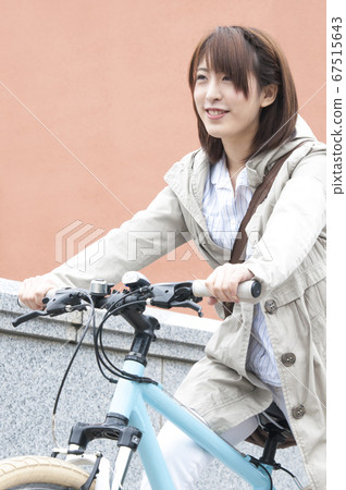 Woman riding a bicycle Woman riding a bicycle 67515643