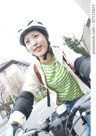 Woman riding a bicycle Woman riding a bicycle 67515825