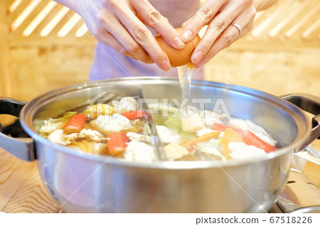 Double flavor hot pot on wood background 67518226