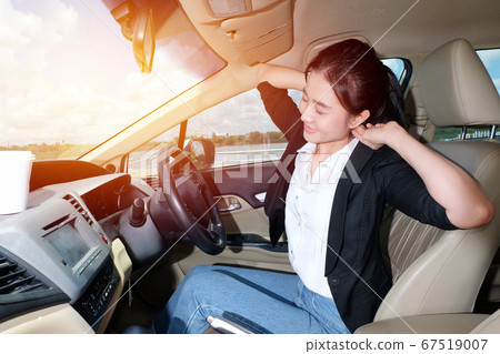 A tried women stretching her arms out to relax 67519007