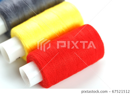 Sewing threads of different colors on reels on a 67521512