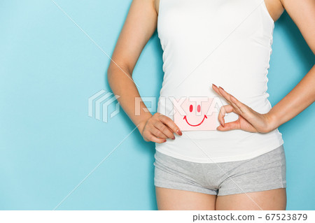 Woman with smile on stomach 67523879