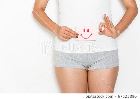 Woman with smile on stomach 67523880