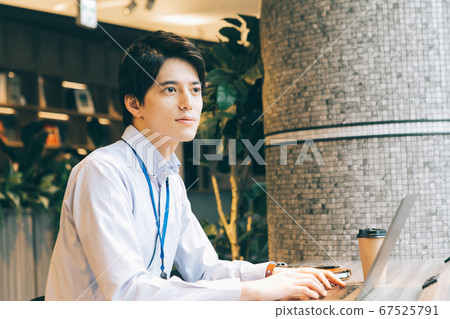 Young men working in the office Young men working in the office 67525791