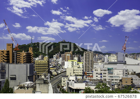 Dogo Onsen, Matsuyama City, Ehime Prefecture, with a view of Matsuyama Castle from Dogo Park 67526878
