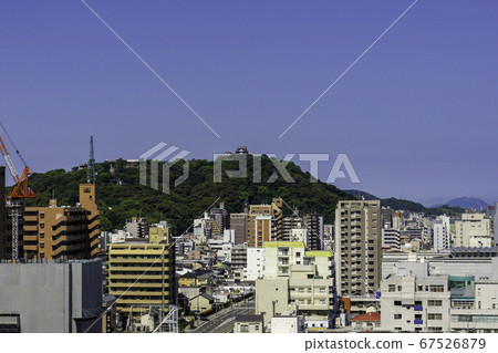Dogo Onsen, Matsuyama City, Ehime Prefecture, with a view of Matsuyama Castle from Dogo Park 67526879