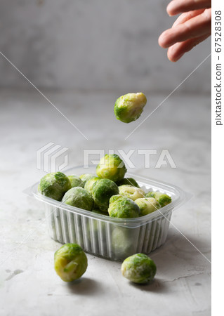 Frozen Brussels sprouts in the storage boxe on the 67528308