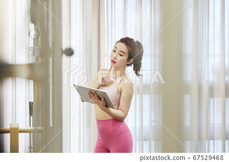 Young woman,exercise,pilates,sport Young woman,exercise,pilates,sport 67529468