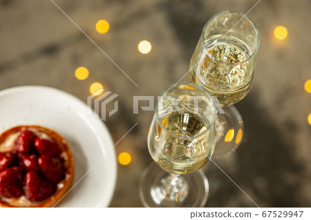 Glasses of sparkling champagne, close up. Warm colored. Celebration event, holidays, drinks concept Glasses of sparkling champagne, close up. Warm colored. Celebration event, holidays, drinks concept 67529947