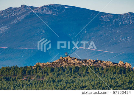 Fire watching hut on top of the mountain 67530434