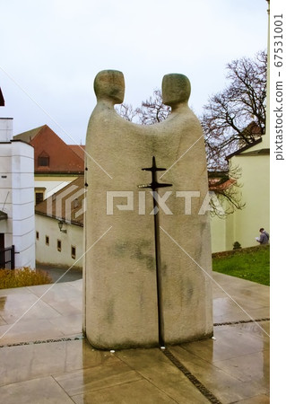 Brno, Czech republic - 9. 11. 2019: Statue of two holy men standing together in Brno near Peter and Pavel 67531001