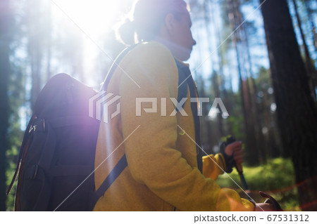 Walking in summer forest. Female tourist hiking alone. Walking in summer forest. Female tourist hiking alone. 67531312