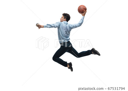 Man in office clothes playing basketball on white background. Unusual look for businessman in motion, action. Sport, healthy lifestyle. Man in office clothes playing basketball on white background. Unusual look for businessman in motion, action. Sport, healthy lifestyle. 67531794