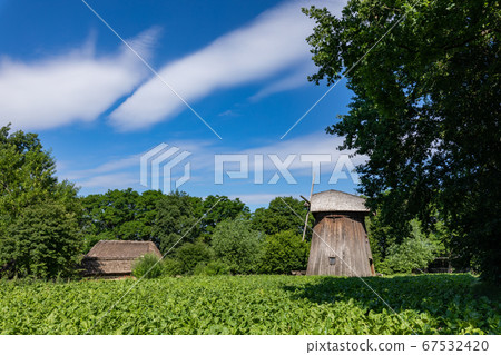 Wooden mill in the countryside. Wooden mill in the countryside. 67532420