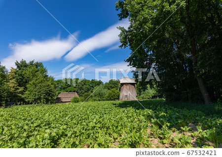 Wooden mill in the countryside. 67532421