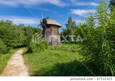 Wooden mill in the countryside. 67532425
