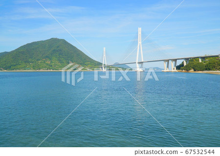 Shimanami Kaido: Tatara Ohashi Bridge and the Seto Inland Sea and Ikuchijima Island, when the rainy season is seen from Omishima 1 Imabari City, Ehime Prefecture 67532544
